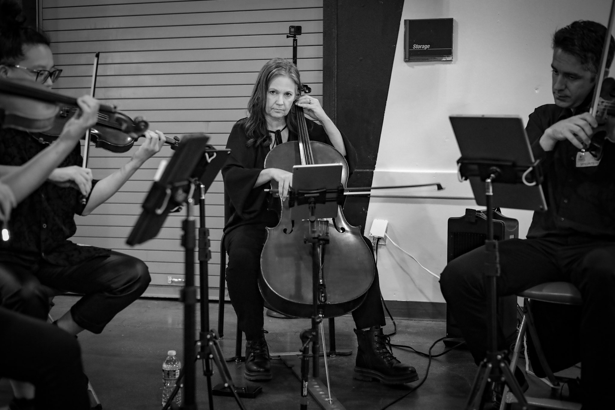 Mika Larson performing cello with a string ensemble